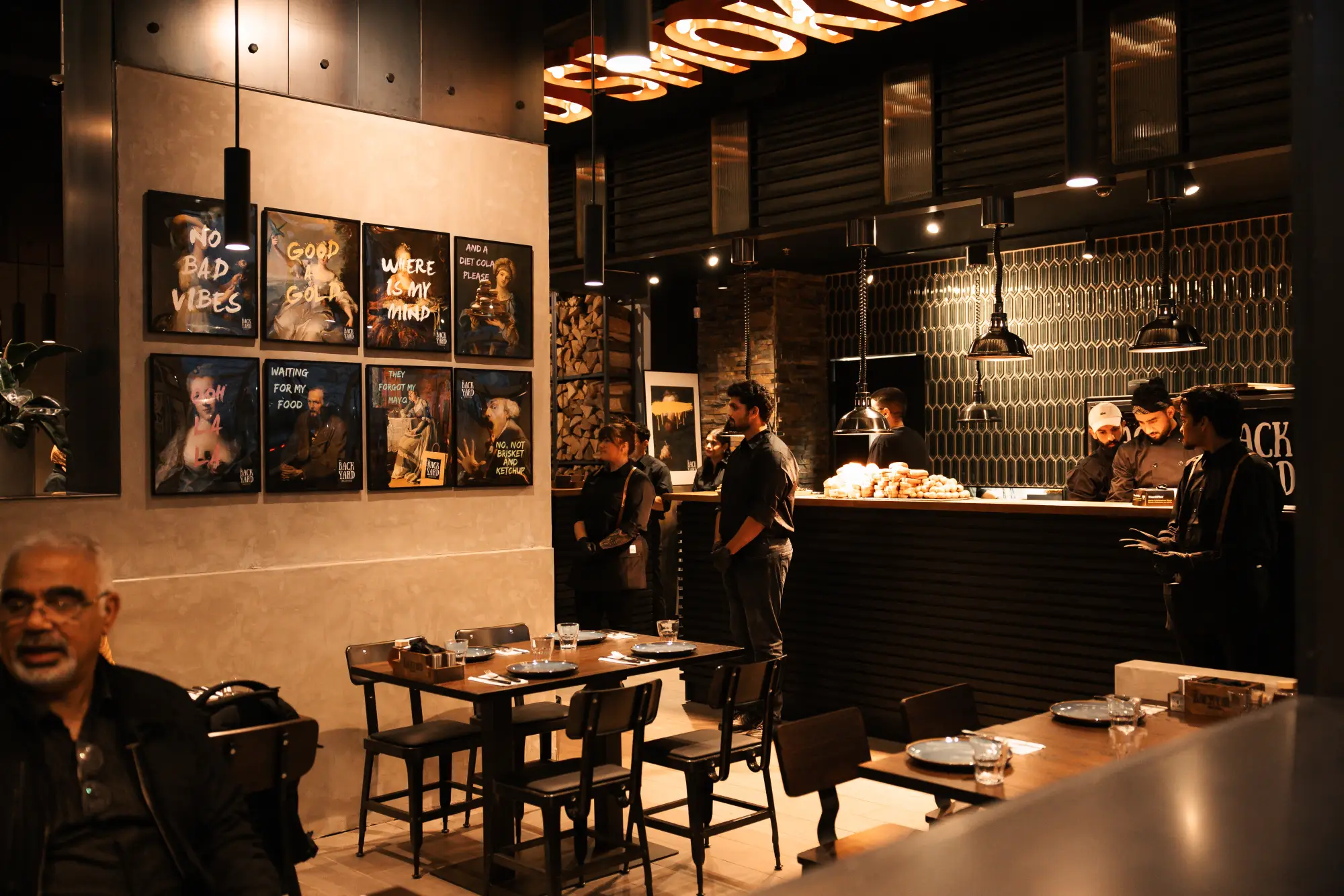 Dining room with local art wall at Backyard Smokehouse Mississauga