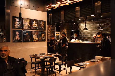 Dining room with local art wall at Backyard Smokehouse Mississauga