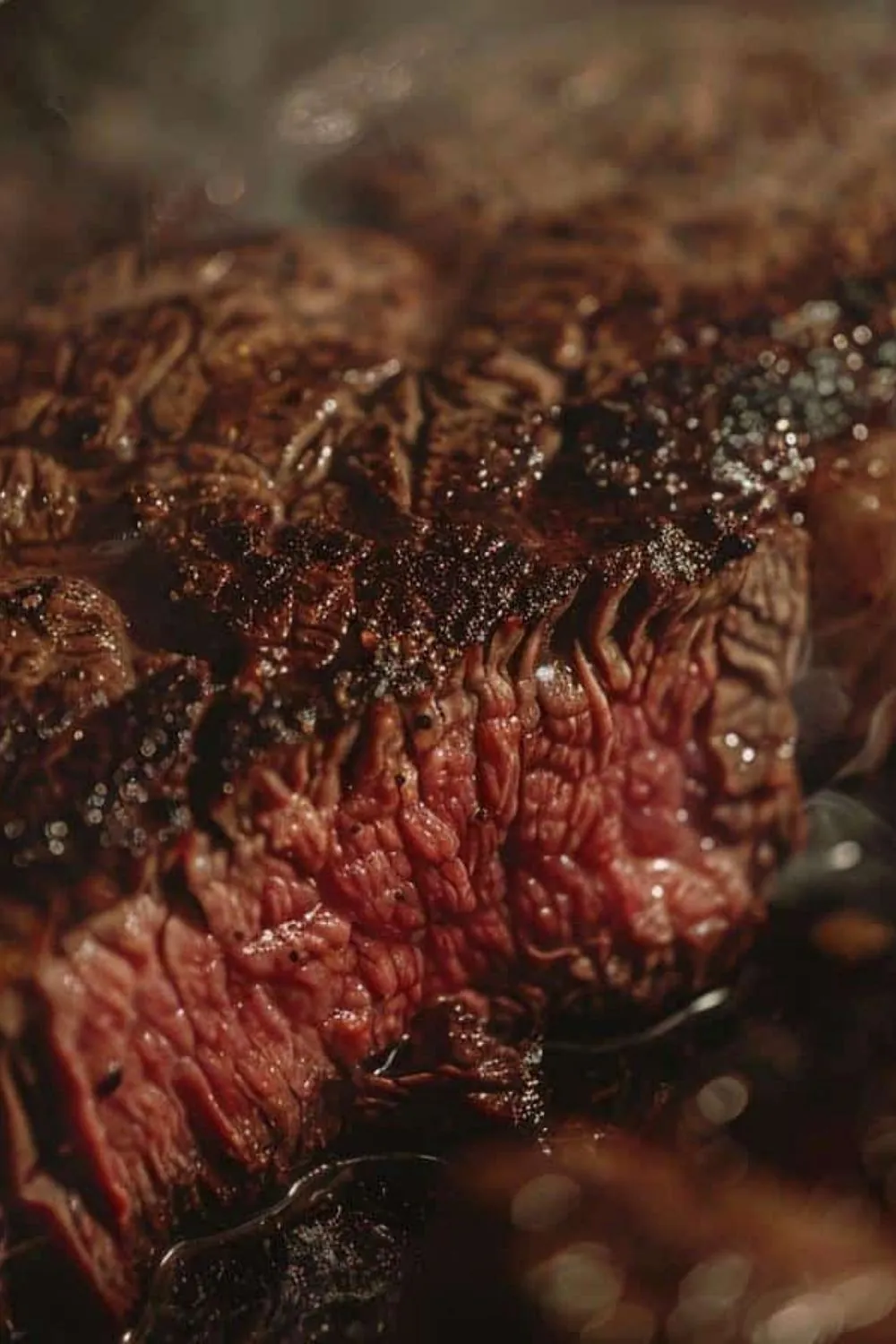 Best group dining Toronto BBQ — Premium ribeye steaks being seared on an open flame grill